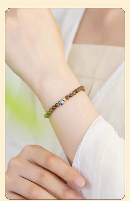 ZenHima Qi Nan Agarwood Mala Beads Bracelet with Lotus Design - ZENHIMA