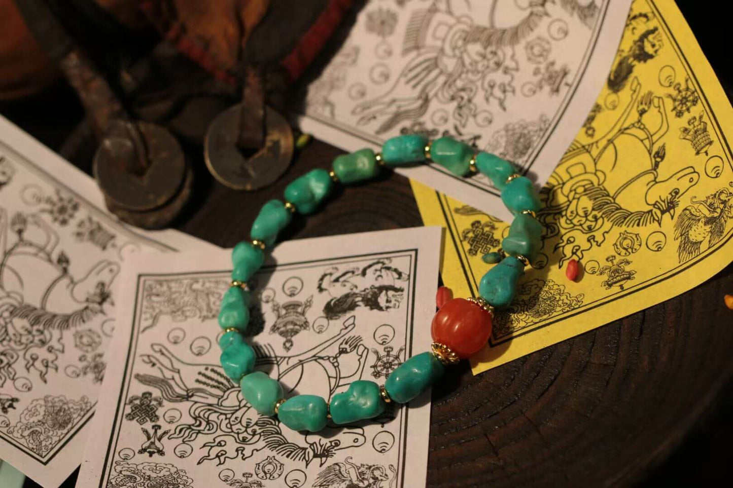Turquoise bracelet with South Red Agate surrounded by vintage cards and accessories.