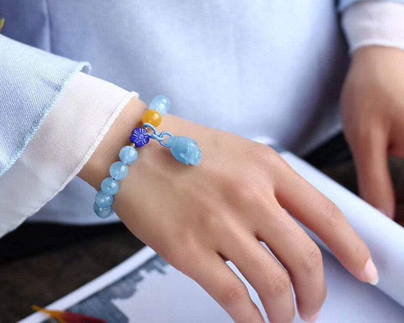 Aquamarin-Armband mit kleinen Blüten aus Bernstein und Lapislazuli