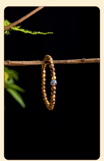 ZenHima Qi Nan Agarwood Mala Beads Bracelet with Lotus Design - ZENHIMA